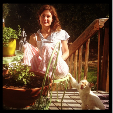 My visiting friend Christy aside my "herb garden," valiantly ignoring the yeti cat. 
